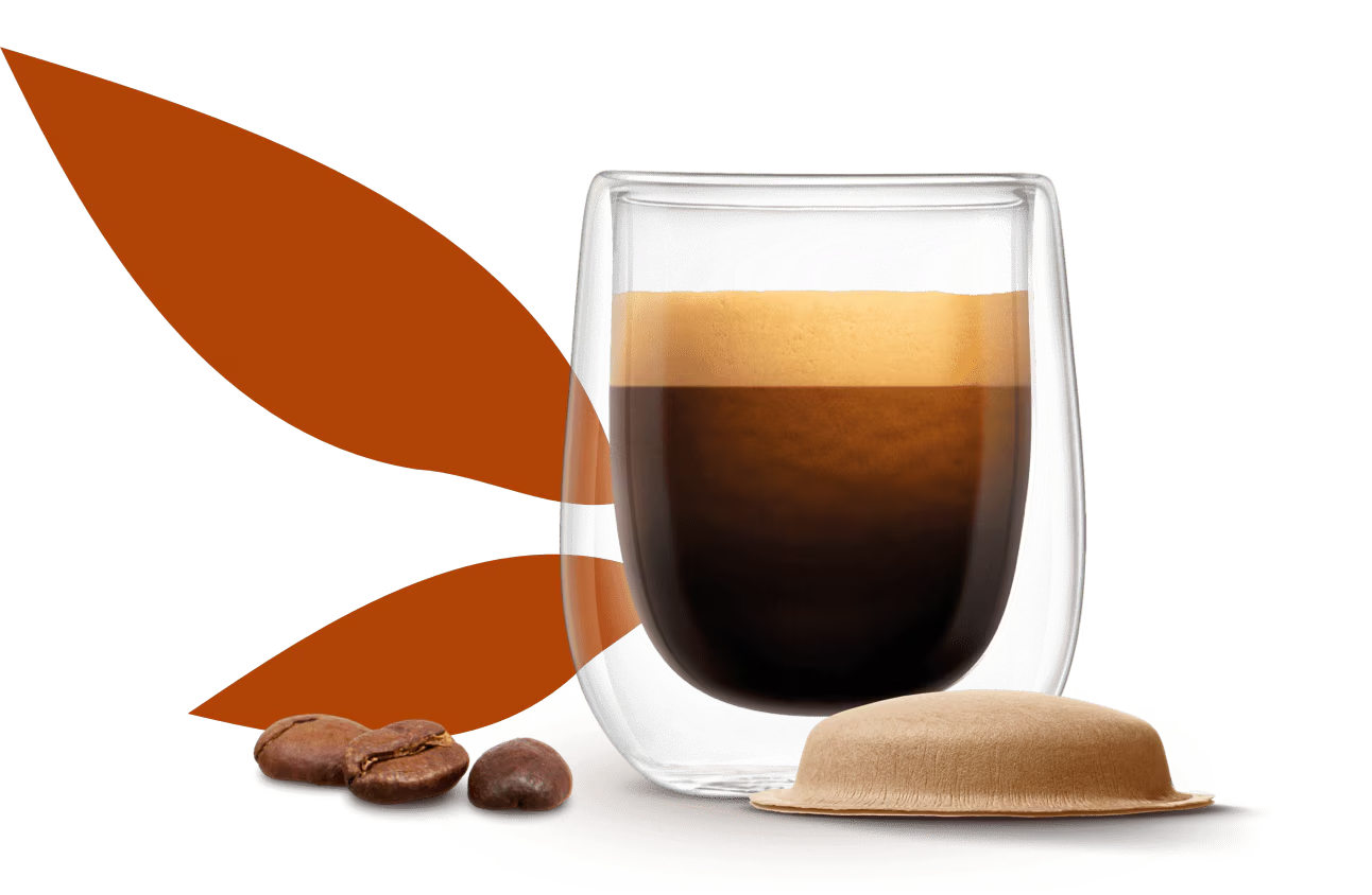 cup of coffee next to a paper-based pod